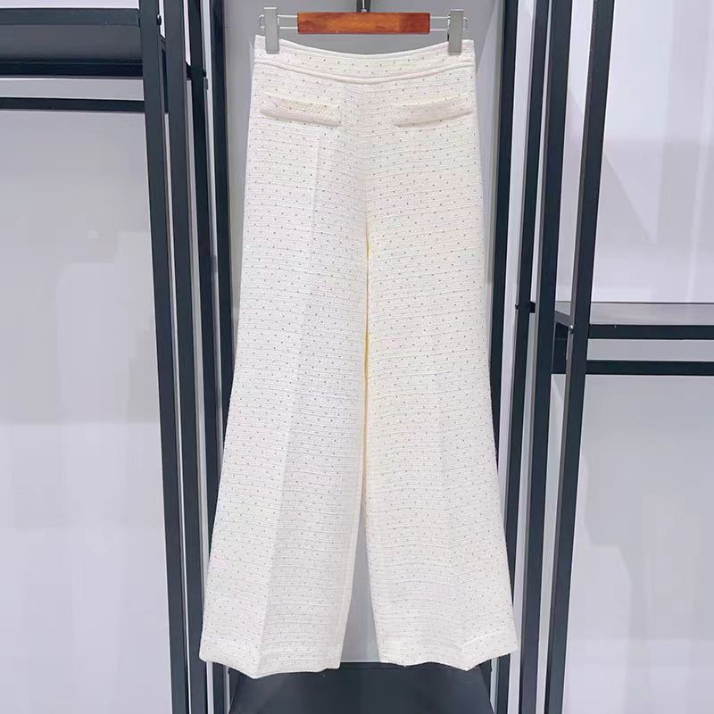 Women's elegant two-piece set: shorts and top or stylish trousers