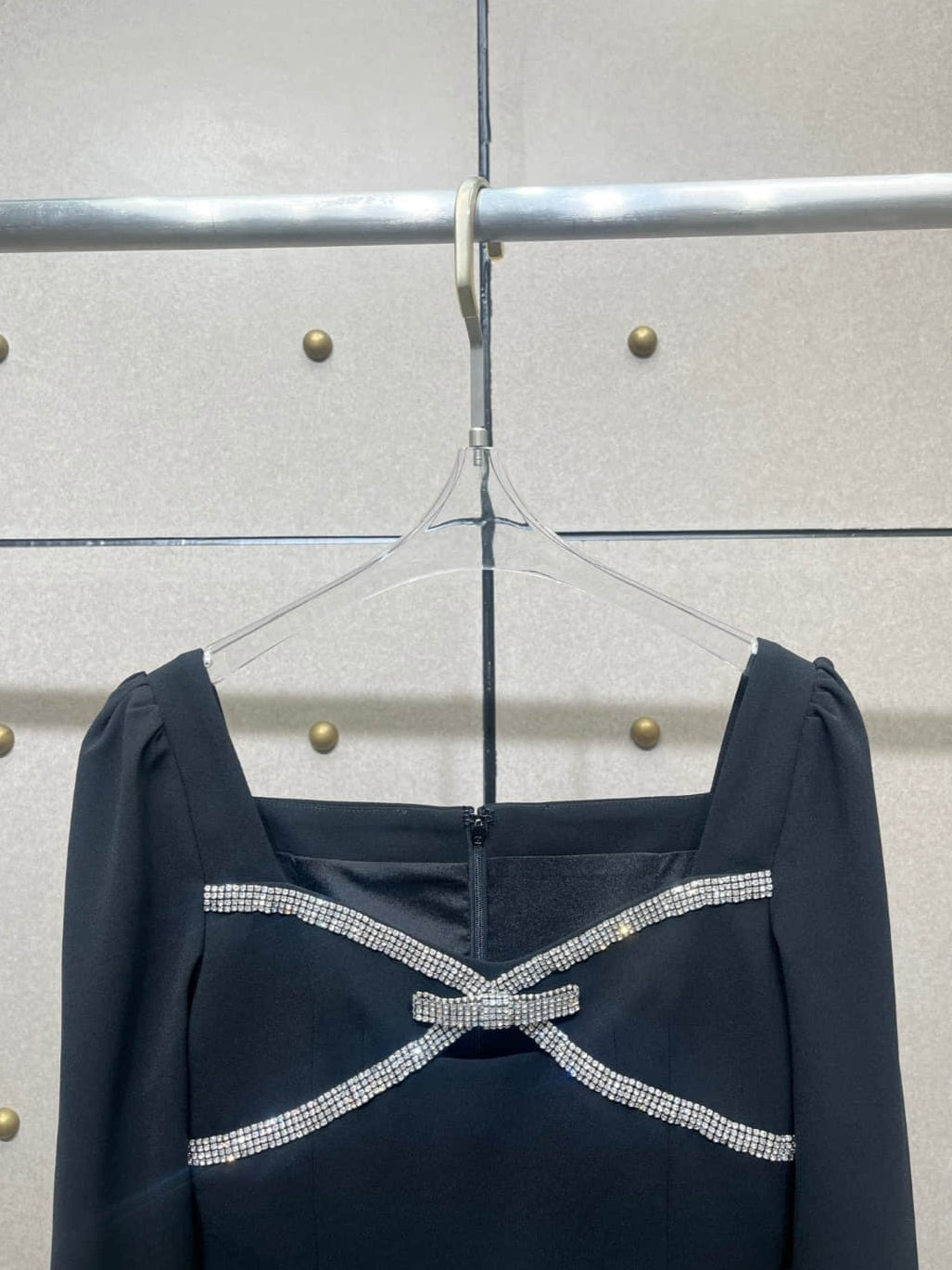 Elegant black long-sleeved dress with diamonds
