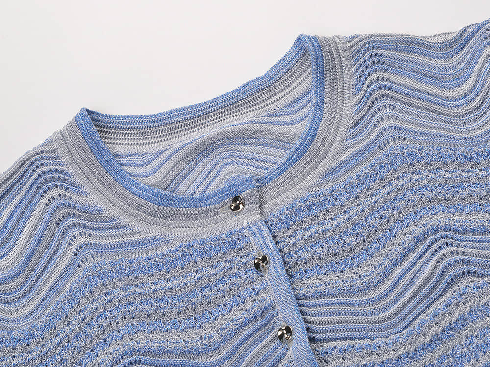 Women's short sleeved cardigan paired with a mid length skirt two-piece set
