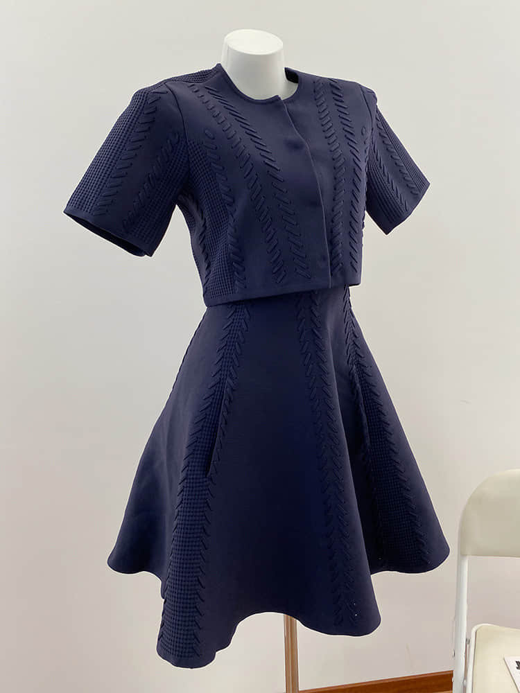 Women's dark blue cardigan paired with mini dress two-piece suit