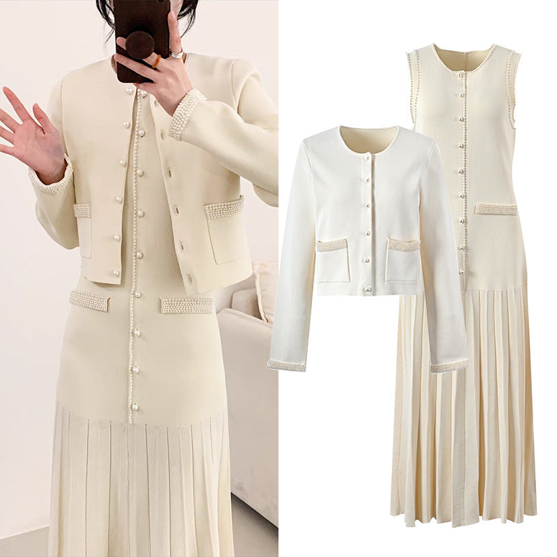 A woman's beige cardigan paired with a slim-fitting knitted dress