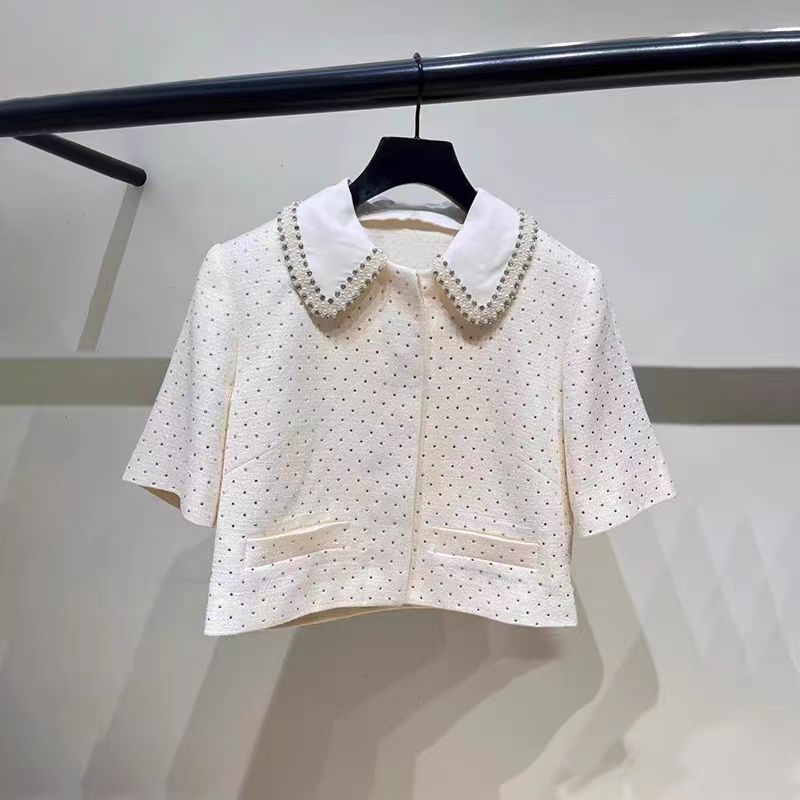 Women's elegant two-piece set: shorts and top or stylish trousers