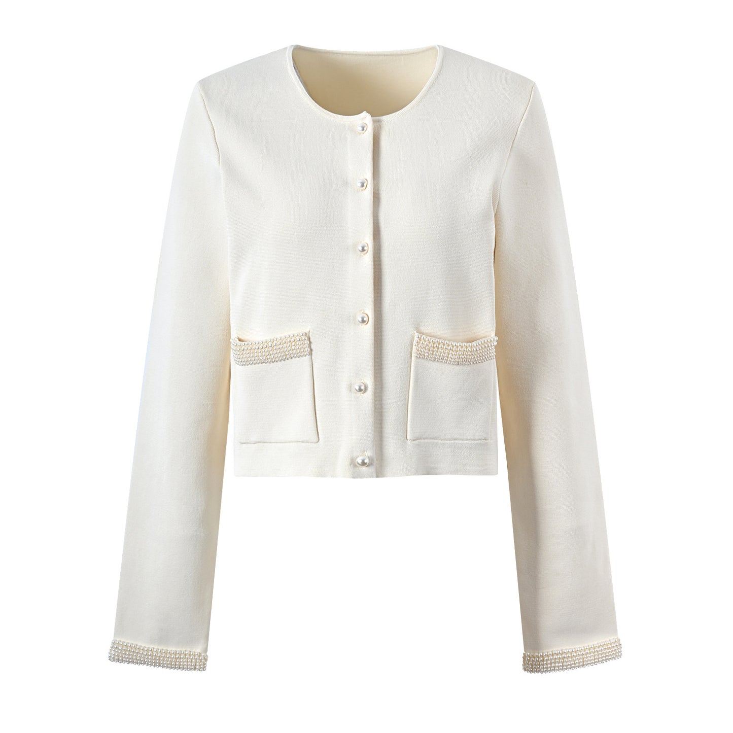 A woman's beige cardigan paired with a slim-fitting knitted dress