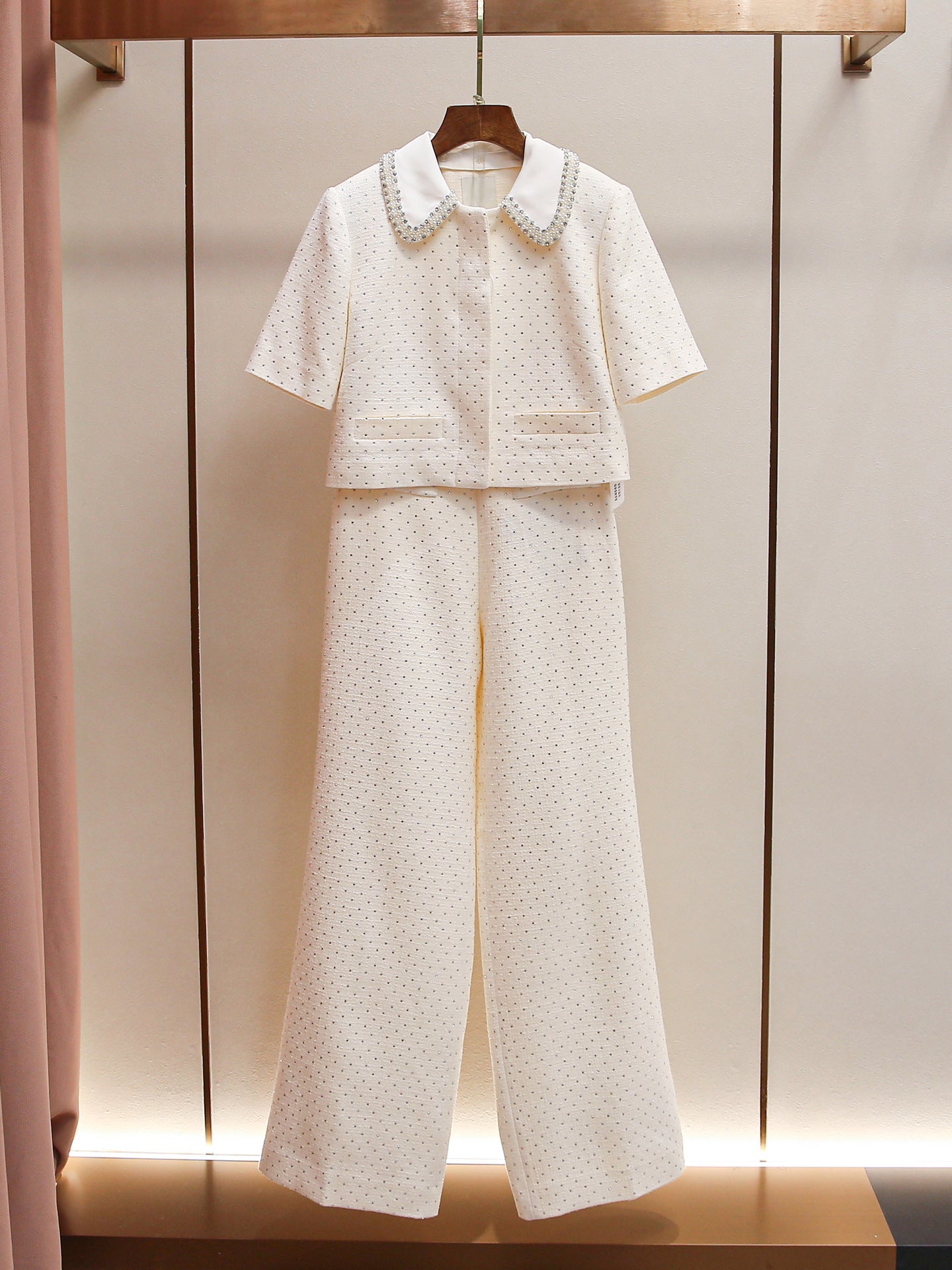 Women's elegant two-piece set: shorts and top or stylish trousers