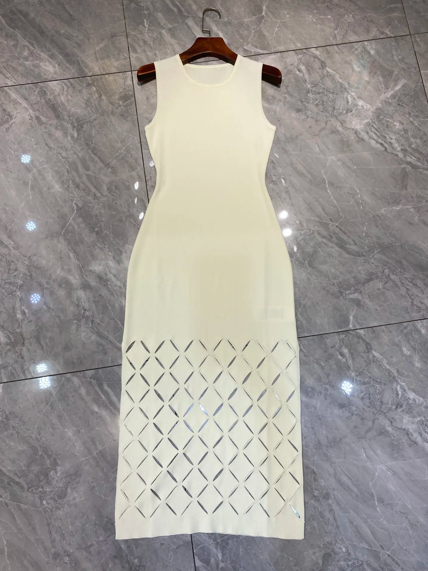 Two piece set of elegant hollowed out cardigan and dress for women